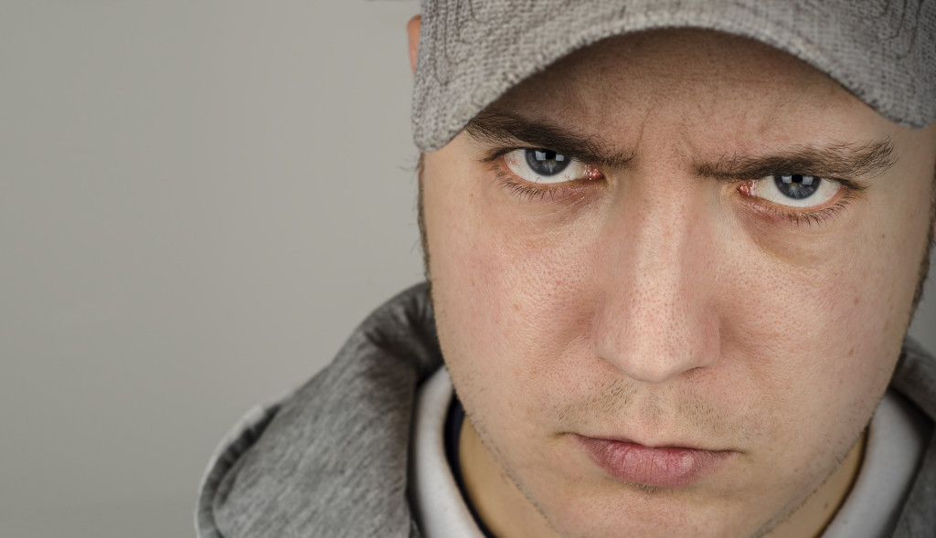 Youth, portrait of a young man wearing a grey baseball cap