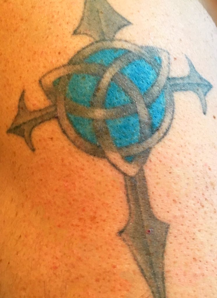 Cross and eternity symbol on my left arm.